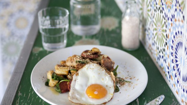 Grilled paprika-spiced sujuk, sliced and serve with crisp roasted potato pieces and fried egg.