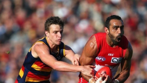 Adam Goodes of the Swans marks in front of Brodie Smith during their 2012 Second AFL Qualifying Final.