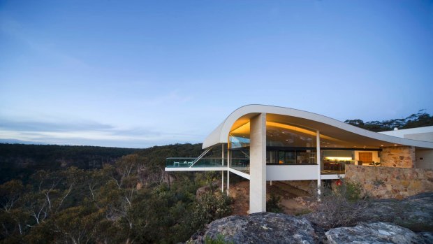 The balcony at The Seidler House in the Southern Highlands extends over the bush like a giant diving platform.