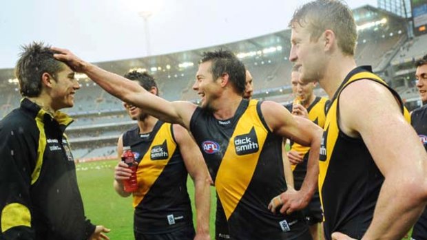 Tigers Dustin Martin, Chris Newman, Ben Cousins and Daniel Connors after the win.