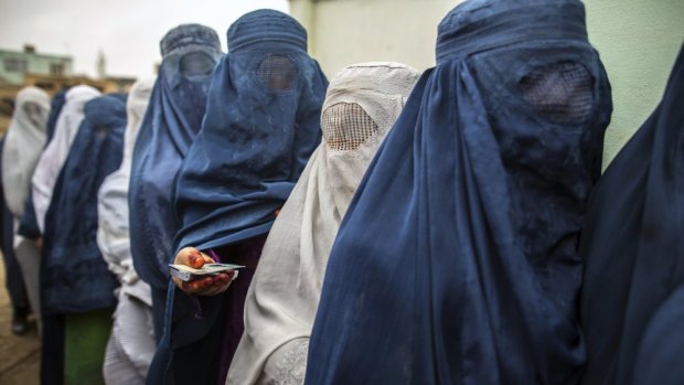 Afghan women stand in line to vote. 