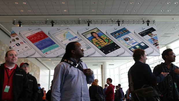 Attendees gather at the Apple Worldwide Developers Conference, where the company unveiled iOS 8 and the new mac operating system Yosemite.