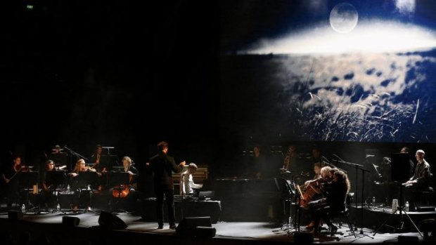 Olafur Arnalds, with an image by Mani Sigfusson, at the Sydney Opera House for the Graphic Festival 2015.