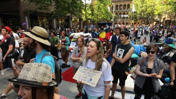 Protesters march at Martin Place in the Occupy Sydney Rally.