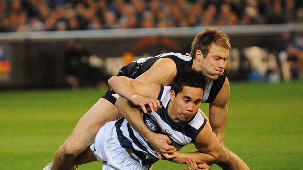 Ben Reid tackles Matthew Stokes during the first preliminary final in 2010.