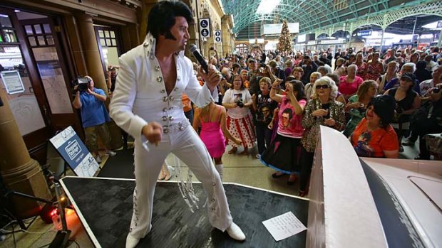 Reliving the King: A Presley impersonator gets the party started at Central Railway Station.
