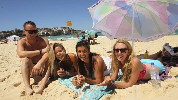 Used Facebook: Sarah Heath (second from left) and her friends arranged to meet after posting a photo of Bondi Beach.