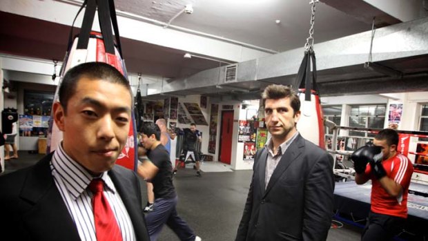 Sweet science ... Ben Zhao, a currency strategist who says his goal has always been to fight, not just train, and Hakan Saglam, an IT consultant who took up boxing to help quit smoking.