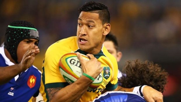 Wallabies fullback Israel Folau is rounded up by the French defence.