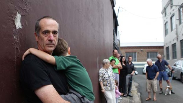 Too many venues ... Anthony Schofield with his son and other concerned locals.