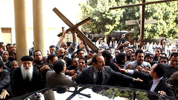 Egyptian Copts protest outside the al-Abasseya Cathedral in Cairo in the wake of the deadly New Year’s Day bomb attack on a Coptic church in Alexandria.