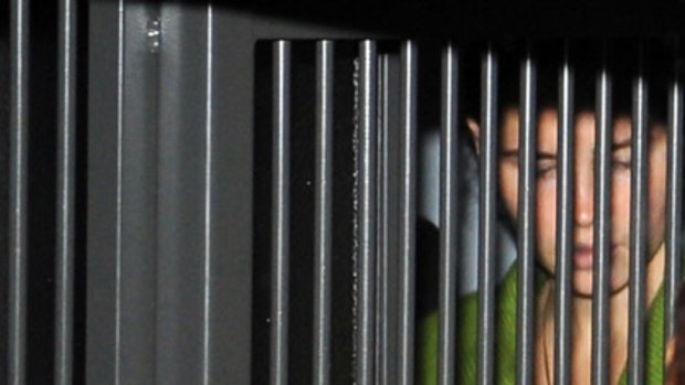 Behind bars... Amanda Knox arrives at the tribunal in Perugia where she was sentenced to 26 years' prison for the murder of her British room-mate Meredith Kercher.