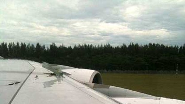An image of the Airbus wing posted on Twitter by a relieved passenger who tweeted  after landing: "Just emergency landed back in Singapore after engine two blew up at take-off and parts ripped through wings. Damn. "