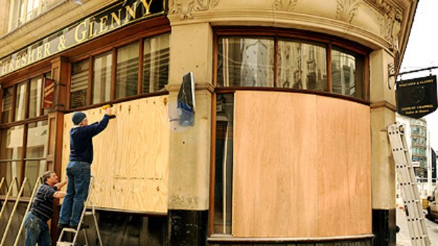 Safety measures: A tailor's in central London is boarded up in readiness for protests during the G20 summit.