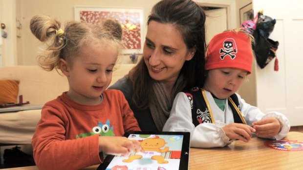 "Big Baby" App designer, Gabrielle Banks, at her Barton home with her two children Max Horth, 4 and Nelly Horth, 3, playing the game on their iPad.