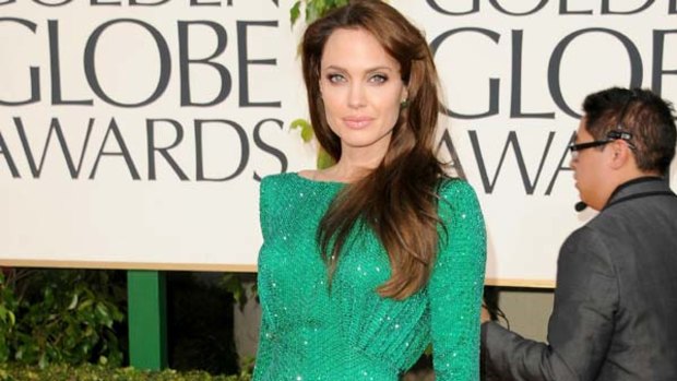 Ditches the black . . . Angelina Jolie.