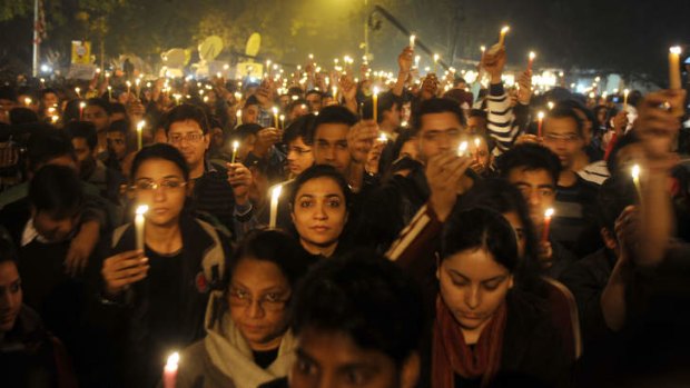 Indian protesters hold candles during a rally in New Delhi late in 2012 after the death of a gang-rape victim.