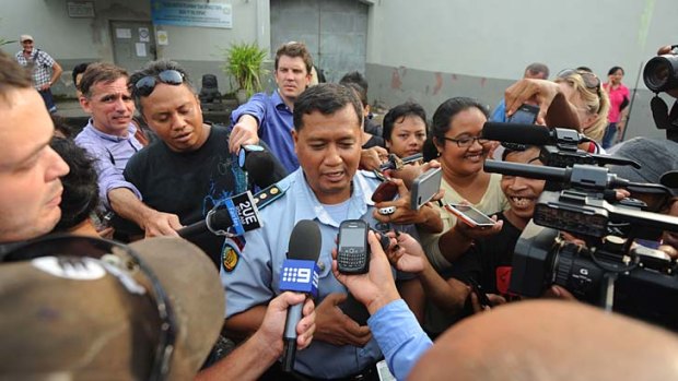 Attention: Kerobokan Prison governor Farid Junaidi addresses media gathered outside.