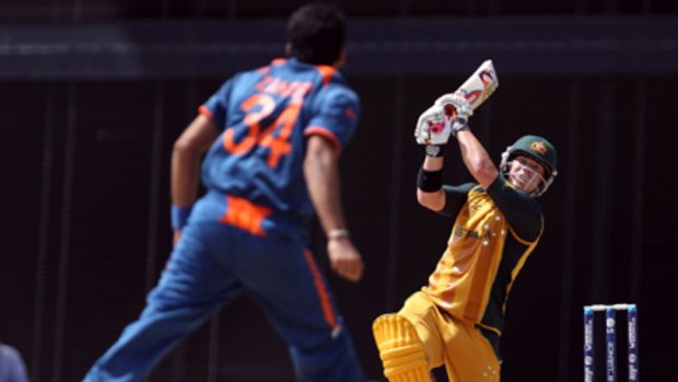 Over the rope...David Warner clubs one of seven sixes in his impressive dig against India.