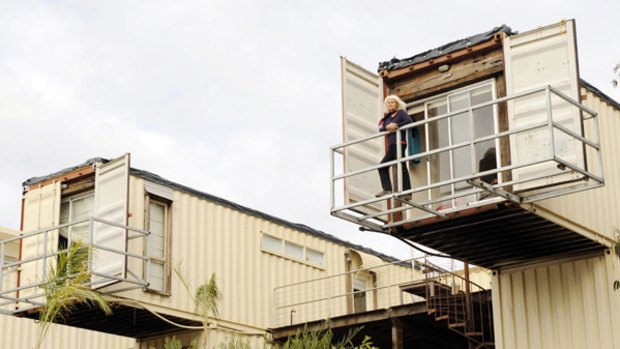 Madeleine McCristal surveys the surrounds from the Hepburn Springs home she is creating using 12 shipping containers coated in a special paint that provides insulation.