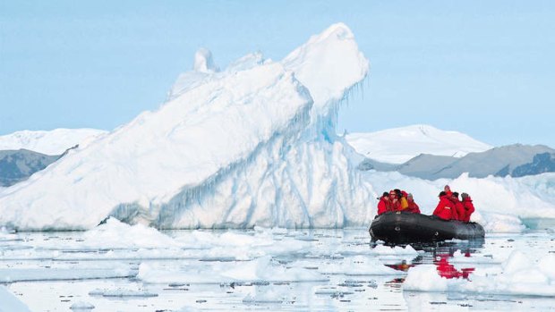Cruisers from Hapag-Lloyd's Bremen roam an Antarctic ice field.