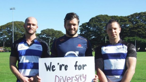 Support: Adam Ashley-Cooper stands with two members of the Sydney Convicts rugby club .