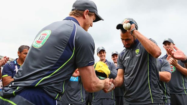 Fawad Ahmed is awarded his first Australian cap by George Bailey.
