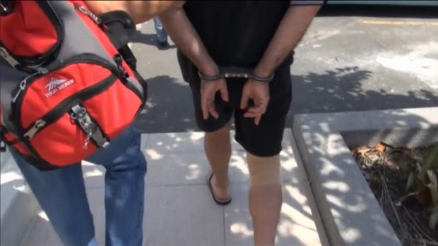 A man is arrested outside South Brisbane train station following a paedophile sting. Photo: Queensland Police Service.