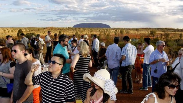 Agenda... cheaper flights mean more tourists for sunset drinks near Uluru.