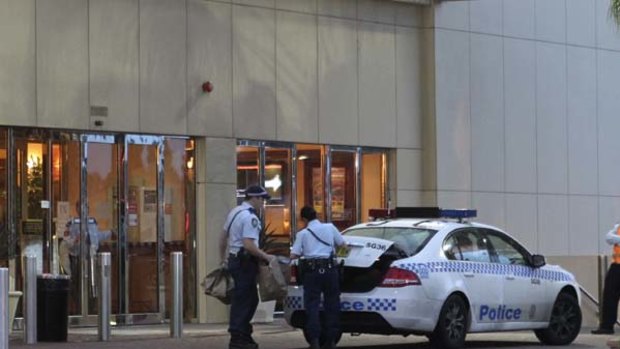 Police take evidence away from the St George Leagues Club at Kogarah.
