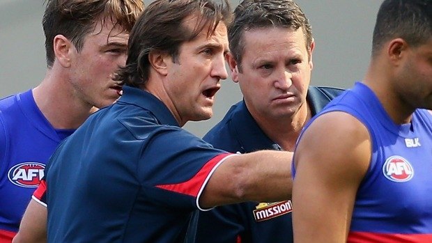 MELBOURNE, AUSTRALIA - APRIL 11:  Luke Beveridge the coach of the Bulldogs talks to his players during the round two AFL match between the Richmond Tigers and the Western Bulldogs at Melbourne Cricket Ground on April 11, 2015 in Melbourne, Australia.  (Photo by Quinn Rooney/Getty Images)