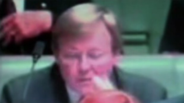 Kevin Rudd at question time allegedly picking his ear wax and eating it. 