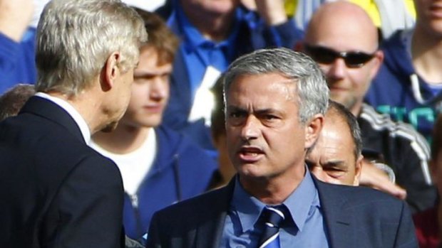 Chelsea manager Jose Mourinho and his Arsenal counterpart Arsene Wenger exchange words during their English Premier League match at Stamford Bridge on Sunday.