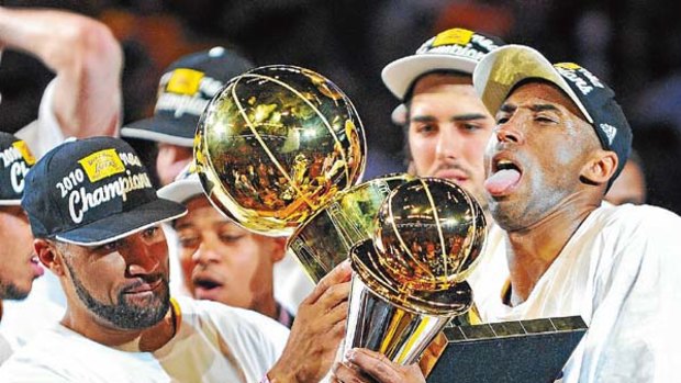 Kobe Bryant (right) struggles with the riches after the Los Angeles Lakers won the NBA championship, with Bryant also being named finals most valuable player.