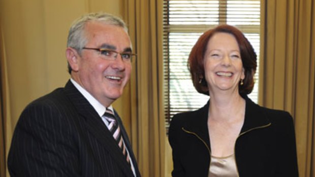 Friend in need ... Prime Minister Julia Gillard greets Tasmanian independent MP Andrew Wilkie.