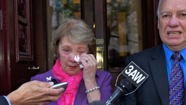 A shattered Roger and Joy Membrey leave the Supreme Court after the jury's verdict failed to close the case of their daughter's murder.