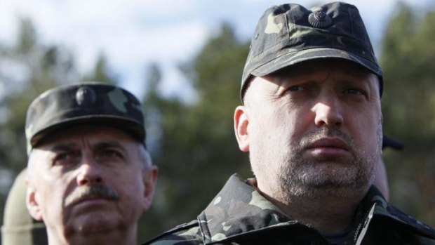 Ukrainian acting president Oleksandr Turchynov, right, visiting a military exhibition in early April.