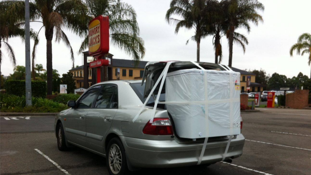 This whitegoods item appears to be held in place with masking tape.