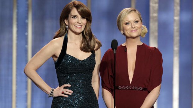 Golden Globes co-hosts Tina Fey, left, and Amy Poehler admit that they are going to hell.