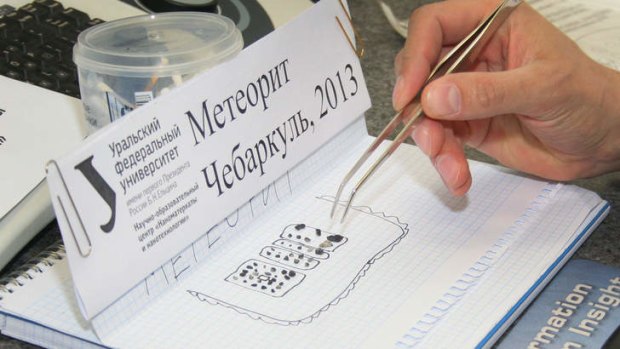 Pieces of porous black rock, reportedly fragments of the meteor that plunged over Russia's Ural Mountains.