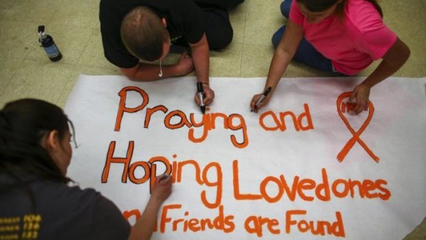 Darrington High School students make posters following the deadly mudslide.