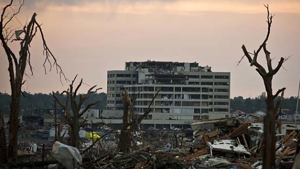 The severely damaged and deserted St John's Regional Medical Centre stands over the ruins of Joplin, Missouri.