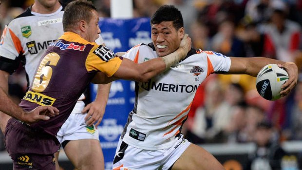 Tim Simona of the Tigers attempts to break away.