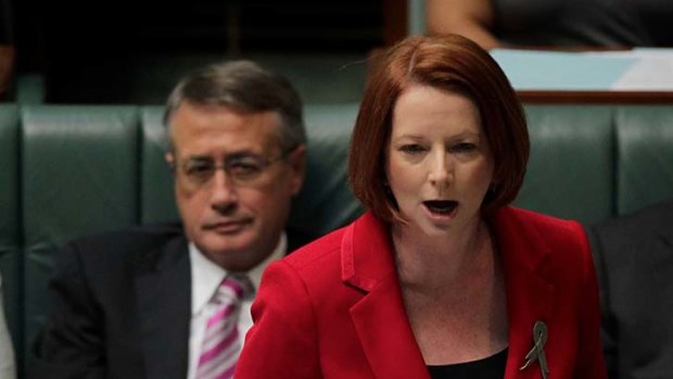 Fierce ... the Prime Minister, Julia Gillard, criticised Tony Abbott for attending a rally with "grossly sexist signs".