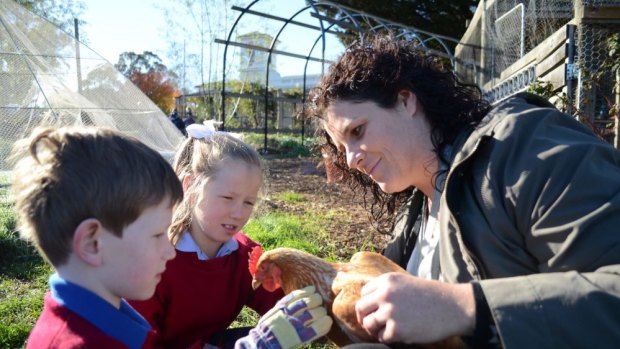 Sarah Page, environmental science and education teacher at St Francis Xavier Primary School in Ballarat East, with students Lily and Tim.