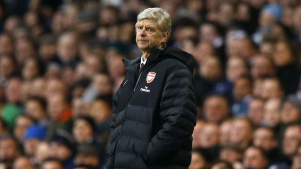 Arsenal manager Arsene Wenger looks glum as Spurs take the derby day honours.