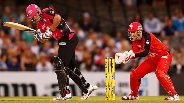 Moises Henriques sets off for a run during his knock of 55 against the Renegades.