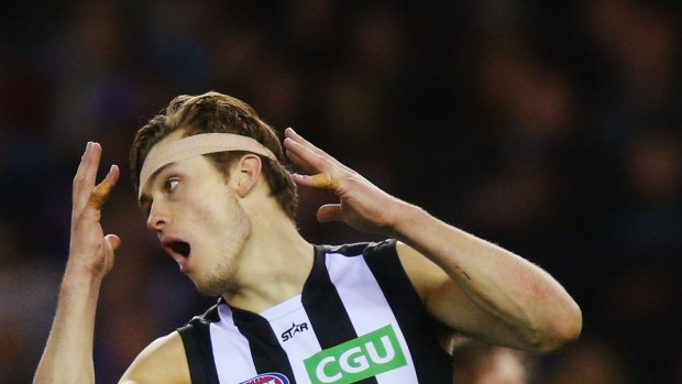 Darcy Moore of the Magpies reacts after missing a goal.