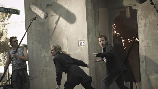 Fitzroy explodes: Guy Pearce (aka Jack Irish) makes a hasty escape during filming of the first of two ABC telemovies based on Peter Temple's novels.