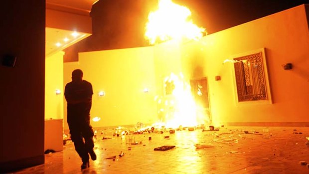 Deadly: The US consulate in Benghazi in flames during the terrorist attack last September.